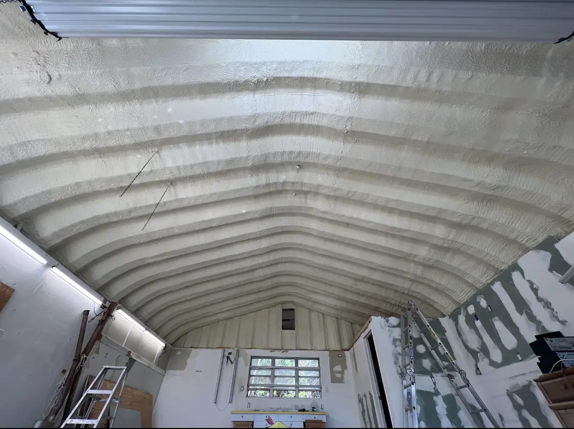 Spray polyurethane foam applied to the underside of a metal roof deck in Redondo Beach